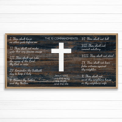 Ten commandments wood framed canvas wall art. This wall art features a thin, solid wood frame handcrafted at our shop located in Ashland, Nebraska. White distressed cross and text on a distressed blue woodgrain pattern background, on premium canvas with a high definition print.