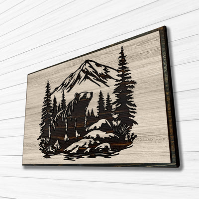 Grizzly bear carved wood wall art featuring Howdy Owl's unique, one of a kind wood finish. This wall art features a grizzly bear, pine tree forest, mountain nature scene that is carved into wood. Handcrafted at our shop located in Ashland, Nebraska our wood wall art can have a distressed tan main board with a dark brown stained carving and edge, or a distressed gray main board with a black stained carving and edge.