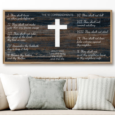 Ten commandments wood framed canvas wall art. This wall art features a thin, solid wood frame handcrafted at our shop located in Ashland, Nebraska. White distressed cross and text on a distressed blue woodgrain pattern background, on premium canvas with a high definition print.