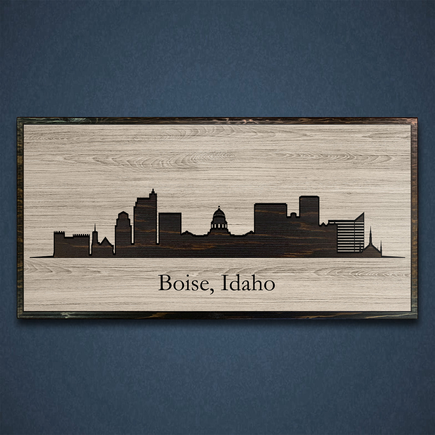 Boise, Idaho city skyline wood all art. Custom carved into solid wood and features Howdy Owl's one-of-a-kind unique wood wall art finish. Personalized with your own text and a great gift idea for any occassion. Handcrafted in Ashland, Nebraska with shipping offered world-wide.